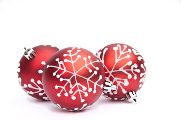 Three Red Christmas bauble tree decorations on white background