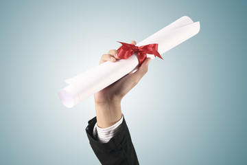 Diploma with a red ribbon