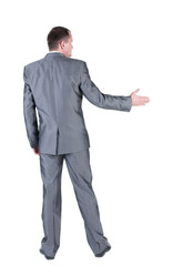 businessman extending hand to shake. Rear view.