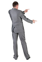 Businessman pointing at wall. rear view.