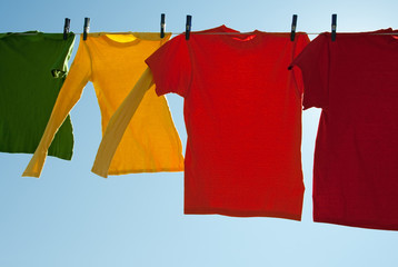 Bright multi-colored clothes drying in the wind