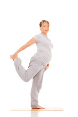 Pregnant woman practices yoga