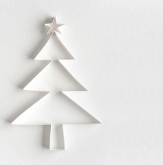 Christmas tree made of paper on white background