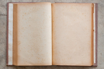 Open blank aged book with brown rim