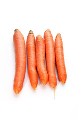 Five pieces of fresh carrots against white background