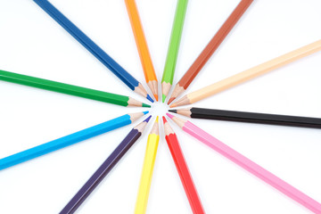 Naklejka premium Set of colored pencils in the shape of a star. On a white backgr