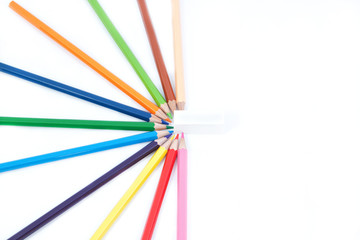 Naklejka premium A set of colored pencils in the shape of half a star and eraser.