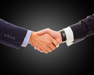 Handshake - Hand holding on black background