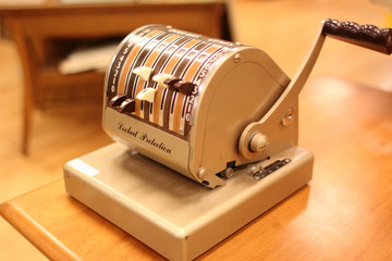 An antique check printer used to print digits on checks.