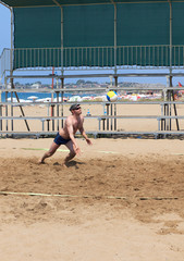 Man playing volleyball on the beach