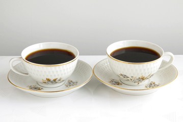 two cups of black coffee