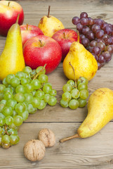 apples grapes and pears, wooden table