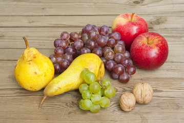 apples grapes and pears, wooden table
