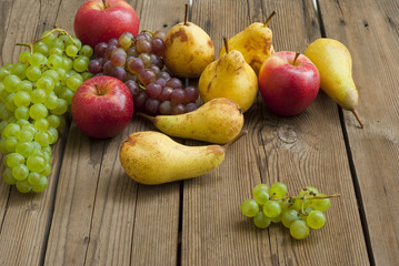 apples grapes and pears, wooden table