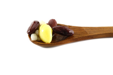 cereal on wood spoon isolated in white background