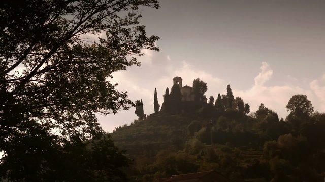 church and hills in montevecchia at sunset, brianza, italy