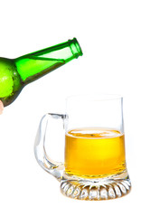 Pouring beer isolated on white