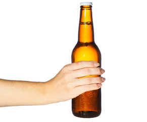 Woman hand holding bottle of beer