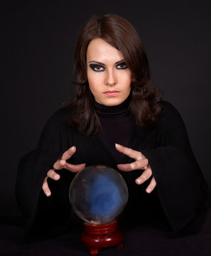 Young woman with crystal ball.