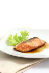 grilled salmon with teriyaki sauce isolated in white background