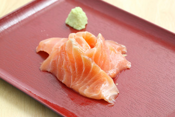 salmon sashimi in wood background