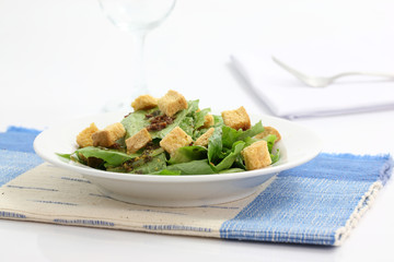 Salad with wine glass isolated in white background