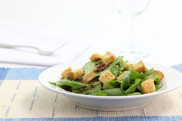 Salad with wine glass isolated in white background