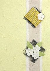 papercraft flower in yellow background