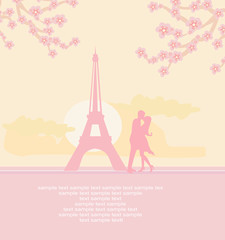 Fototapeta na wymiar Romantic couple in Paris kissing near the Eiffel Tower.