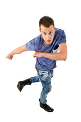 Naklejka premium Young man dancing on white background