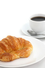 croissant with coffee isolated in white background