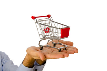 Fototapeta premium Hand holding shopping cart on white