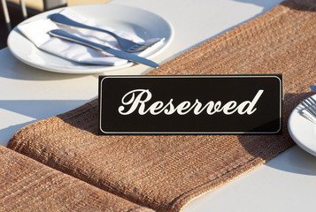 Reservation sign on restaurant table