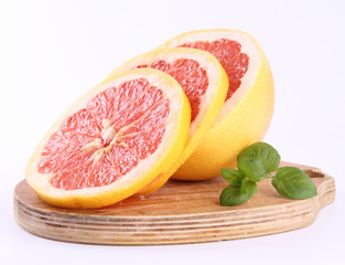 Grapefruit, a sliced half on a white background