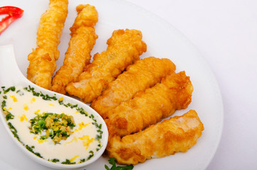 Battered chicken served with sauce
