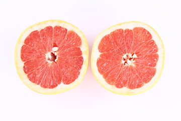 Fototapeta na wymiar Grapefruit cut in half on white background