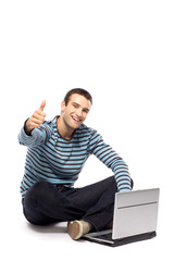 Man with laptop showing thumbs up
