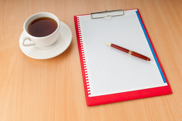 Binder with blank page and tea