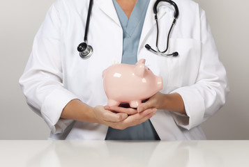 Doctor with Stethoscope Holding Piggy Bank Abstract