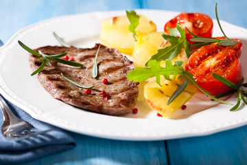 Grilled steak with grilled vegetables and rosemary