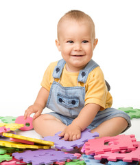 Little boy play with alphabet