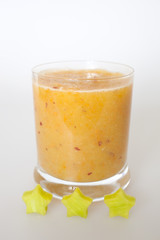 glass with blended fruits decorated with the stars