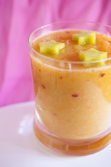 glass with blended fruits decorated with the stars