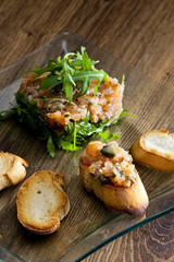 salmon tartar with ruccola