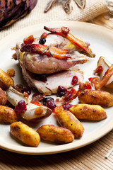 baked pheasant with bacon, pear, raisins on brandy