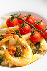 pasta penne with prawns, spinach and grilled cherry tomatoes