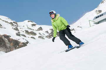 Fototapeta na wymiar Skiing - young skier on ski slope