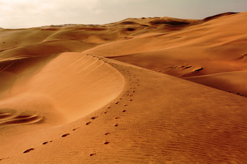 Fototapeta na wymiar sand dune with footprints