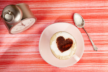 cappuccino with heart, red stripy backdrop