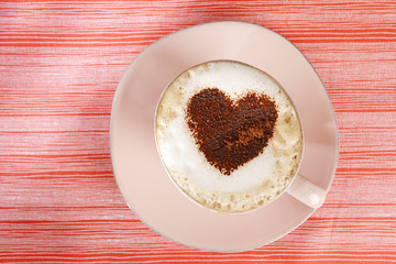 cappuccino with heart, red stripy backdrop